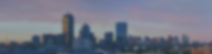 Photo of the Boston skyline at dusk with a heavy blur overlay